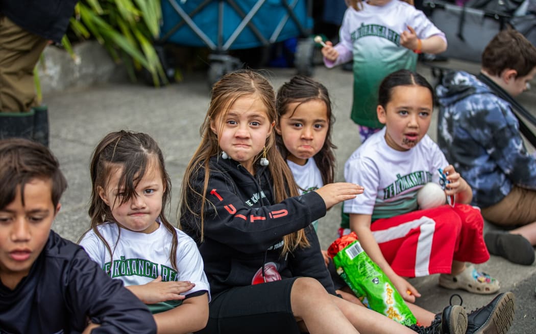 Tamariki celebrate the Koroneihana of Te Arikinui Kuini Nga wai hono i te po at Turangawaewae Marae, Ngāruawāhia. (2025)