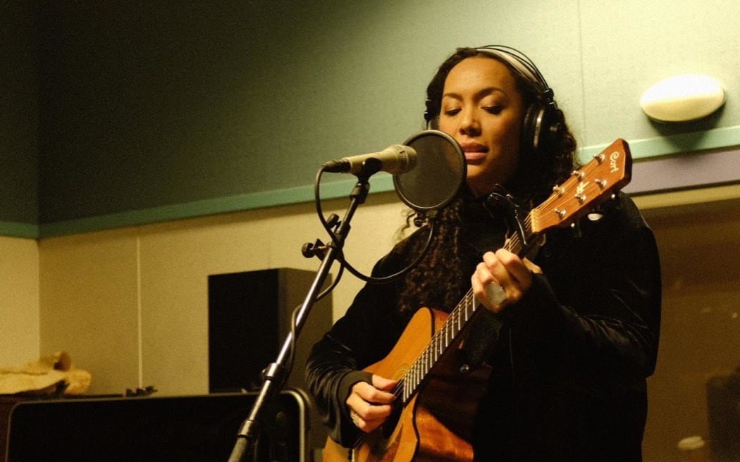 Wellington musician AJA performing in RNZ's Wellington studio