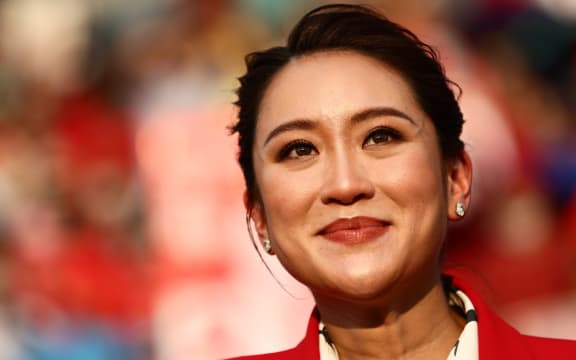 (FILES) Thai candidates for prime minister Paetongtarn Shinawatra, known by her nickname "Ung Ing" and the youngest daughter of former prime minister Thaksin Shinawatra, looks on during an election rally for Thailand's main opposition Pheu Thai party at the Thunder Dome Stadium in Nonthaburi, north of the capital Bangkok, on April 5, 2023. Thailand's Pheu Thai party chose Paetongtarn Shinawatra, the daughter of billionaire ex-PM Thaksin, as its candidate for prime minister, it said August 15, 2024, a day after a court dismissed the incumbent premier in an ethics case. (Photo by Jack TAYLOR / AFP)