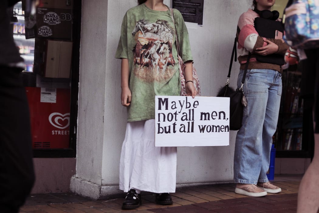 People gathered on Courtenay Place in Wellington to rally against sexual violence.