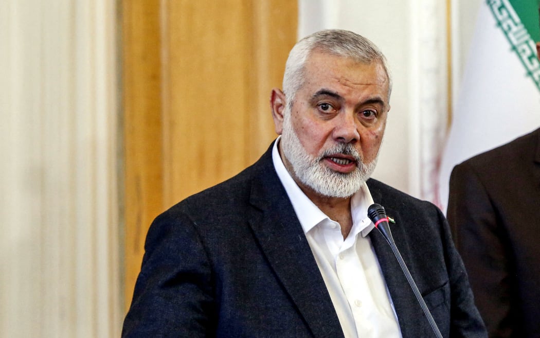 Ismail Haniyeh (L), the Doha-based political bureau chief of the Palestinian Islamist movement Hamas, speaks to the press after a meeting with the Iranian Foreign Minister Hossein Amir-Abdollahian (R) in Tehran on March 26, 2024.