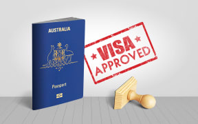 Australia Passport with Visa Approved Wooden Stamp for Travel - 3D Illustration
Some New Zealanders in Australia are asking whether their permanent visa applications were fast-tracked only months before they were not required for them to become citizens.