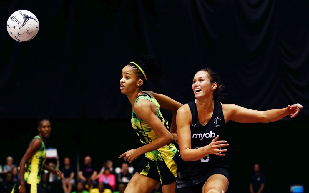 Jamaican defender Shamera Sterling  competing for the ball against Ameliaranne Ekansio