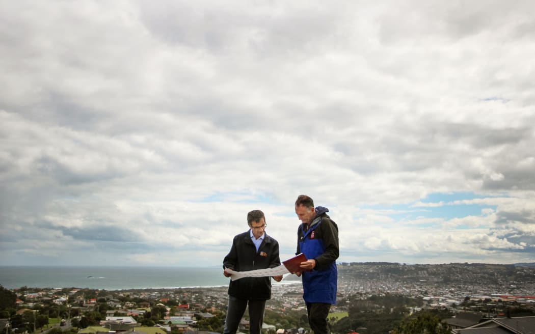 Otago Regional Council natural hazards manager Dr Jean-Luc Payan and GNS Science principal scientist Dr Simon Cox monitor the groundwater behaviour.