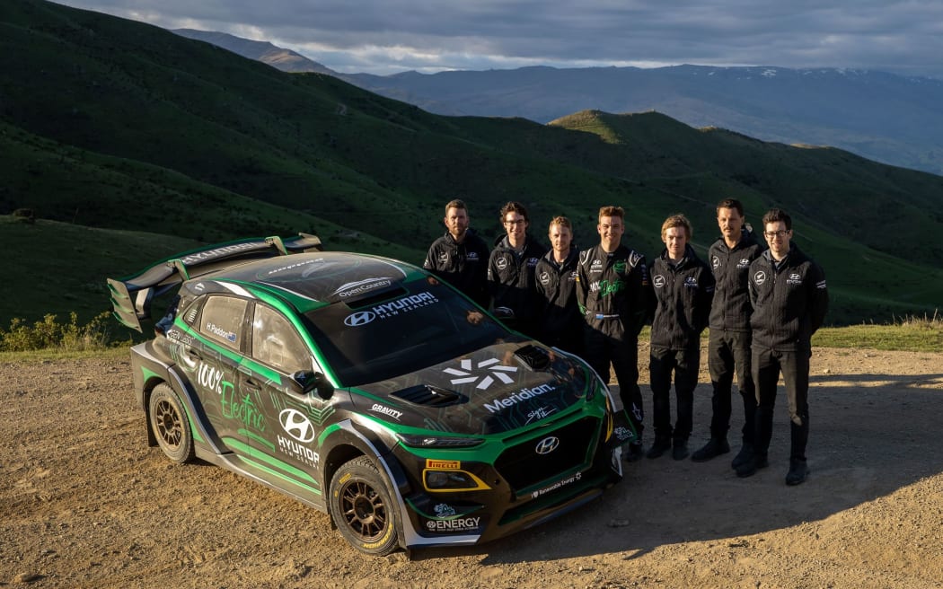 Hayden Paddon and team with his new Hyundai Kona EV rally car.