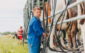 Glen Herud with his mobile milking machine he's since had to sell.