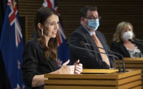 - POOL - Photo by Mark Mitchell.  Prime Minister Jacinda Ardern during the post-Cabinet press conference with Energy Minister Megan Woods and Finance Minister Grant Robertson, Parliament, Wellington. 14 March, 2022.  NZ Herald photograph by Mark Mitchell