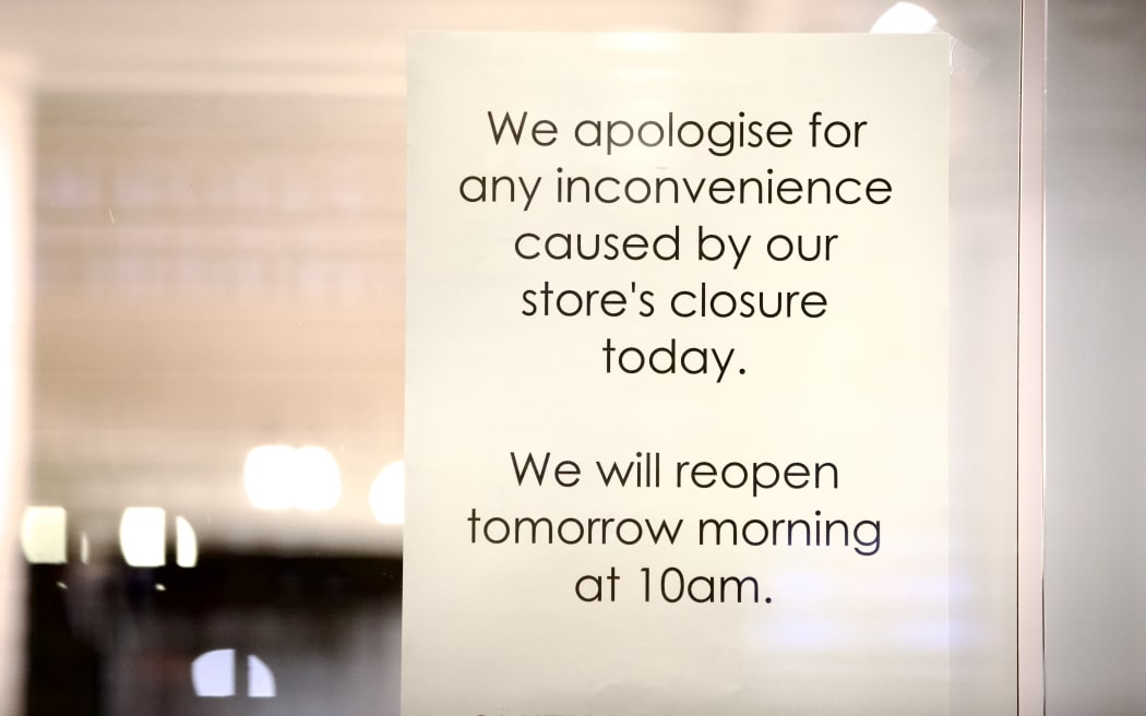 A closed sign on Smith and Caughey's on Queen St, Auckland, on the day it announced its proposal to shut its stores.