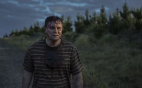 Sweaty and bloody man in his early 40s alone in the New Zealand bush.