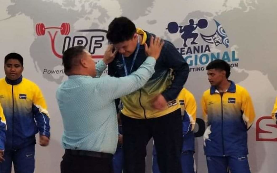 Hipa Tuhipa receives medals