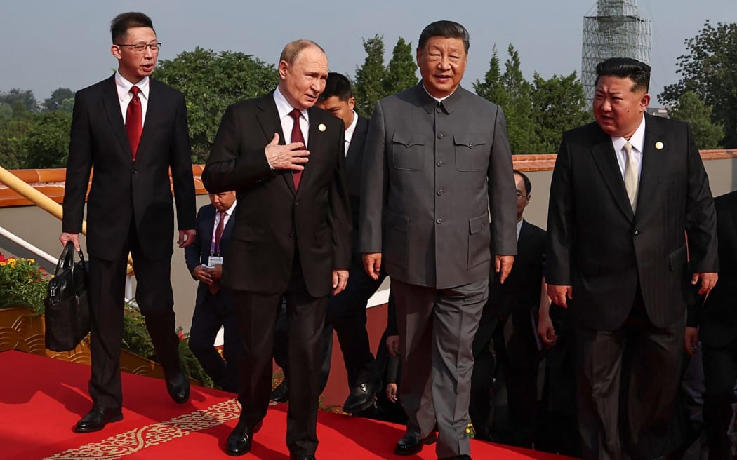 In this pool photograph distributed by the Russian state agency Sputnik, (2nd L-R) Russia's President Vladimir Putin walks with China's President Xi Jinping and North Korea's leader Kim Jong Un before a military parade marking the 80th anniversary of victory over Japan and the end of World War II, in Beijing’s Tiananmen Square on September 3, 2025. (Photo by Alexander KAZAKOV / POOL / AFP)