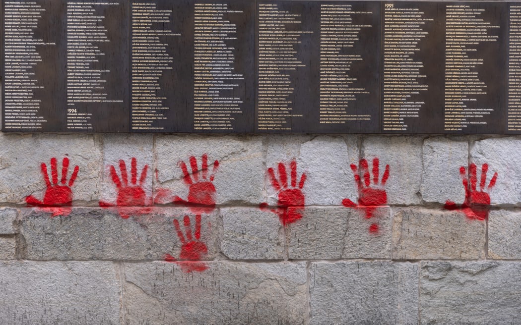 Red hands graffitis are seen on the "Wall of the Righteous" (Mur des Justes) outside the Shoah memorial in Paris, on May 14, 2024, after the monument was vandalized overnight with the president of the Representative Council of French Jewish Institutions (CRIF) denouncing the act as antisemitic. (Photo by Antonin UTZ / AFP)