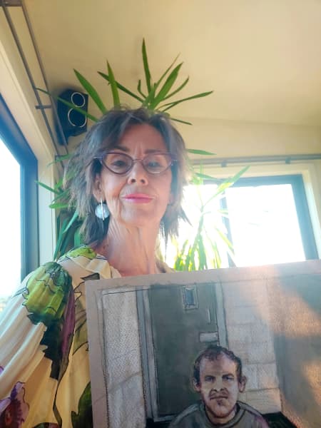 Christchurch artist Stephanie McEwin holds up a sketch she did of Brenton Tarrant at a hearing where he appeared via video link at the Christchurch District Court, from the maximum security prison in Auckland where he was being held on 14 June, 2019.