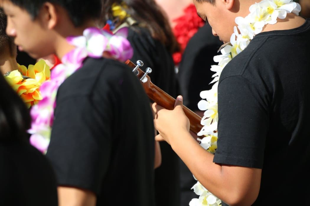 Children playing ukelele at Bill Sevesi's funeral in Auckland.
