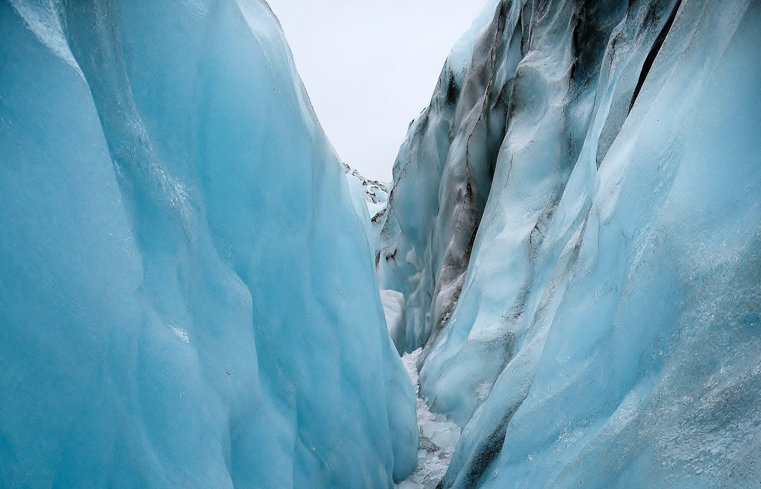 View while hiking through a carved out crevice on Fox Glacier, New Zealand
