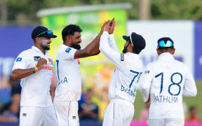 Prabath Jayasuriya and team mates.