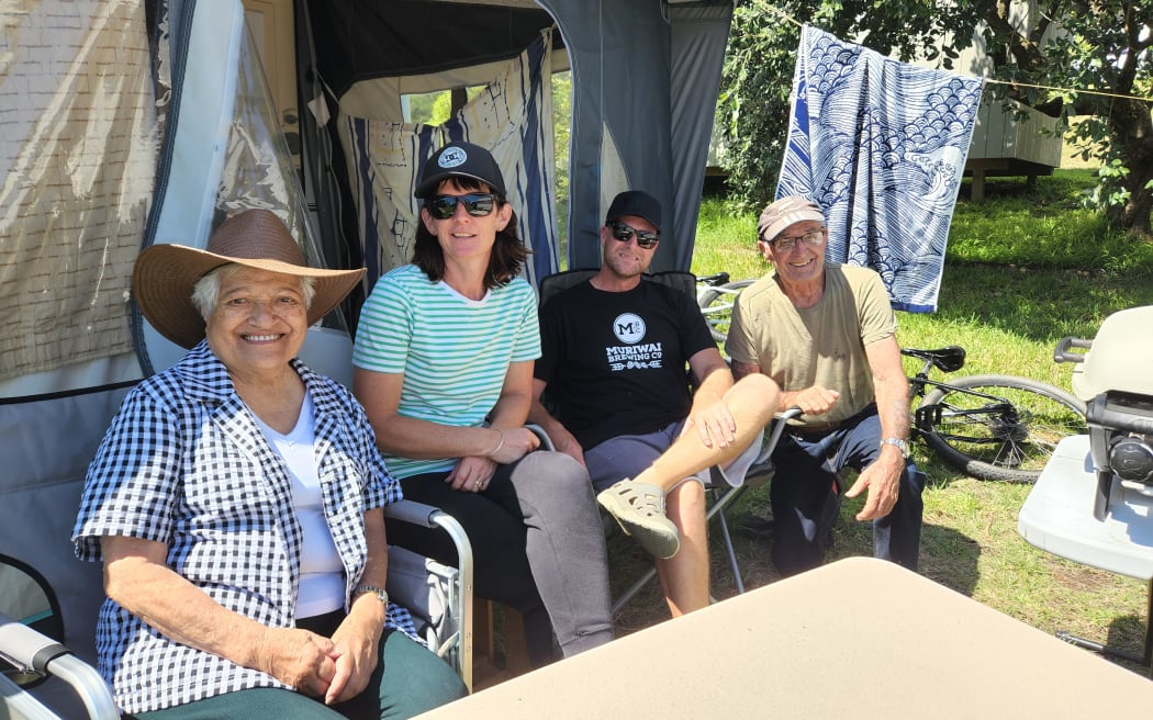 Motutara Road residents Jay Brown and his partner Michaela and their neighbours - all displaced after a slip fell across the road from their homes.