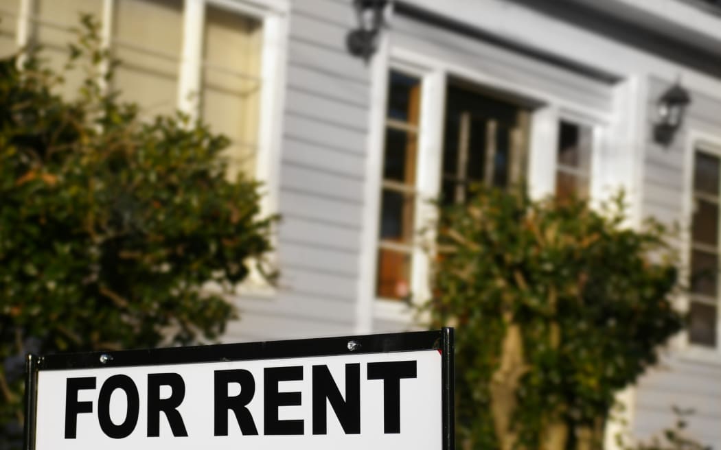 House  with "For Rent" sign in front