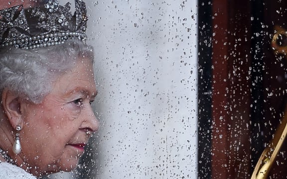 Britain's Queen Elizabeth II returns to Buckingham Palace from the Houses of Parliament following the State Opening of Parliament in central London on May 18, 2016. -