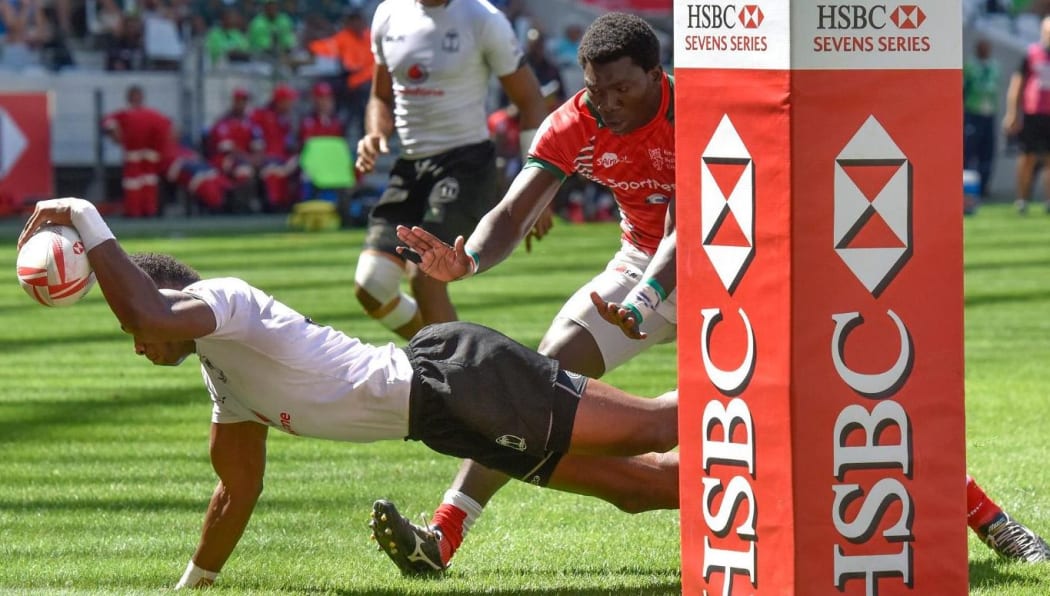 Fiji captain Osea Kolinisau scores against Kenya