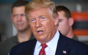 US President Donald Trump speaks during a storm briefing with the US Coast Guard, after disembarking from Air Force One upon arrival at Ellington Field Joint Reserve Base in Houston, Texas, September 22, 2019.