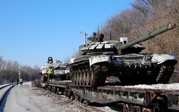 Footage released by Moscow on 16 February 2022 shows Russian soldiers loading tanks and military equipment on to railway platforms after a drill near Ukraine.