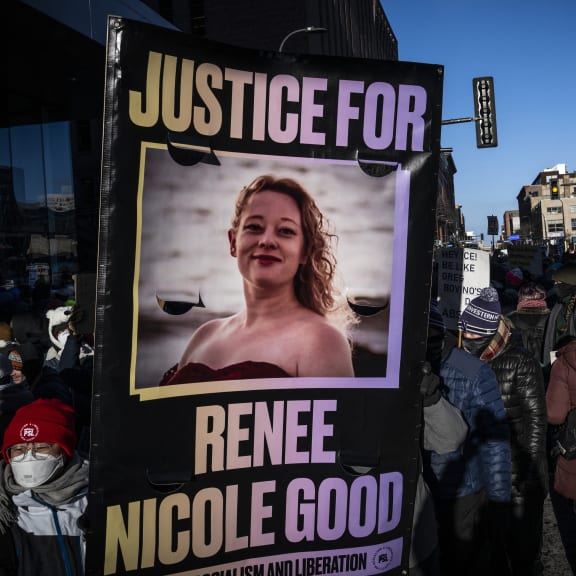 A protestor holds a "Justice for Renee Good" who was shot and killed by a US Immigration and Customs Enforcement agent in Minneapolis, during the "ICE out of Minnesota: Day of Truth and Freedom" protest in Minneapolis, Minnesota on January 23, 2026. The Pentagon has ordered 1,500 US soldiers to prepare for a possible deployment to a state roiled by unrest over an immigration crackdown, US media reported on January 18. The reported preparations come days after President Donald Trump threatened to invoke the Insurrection Act, which enables use of the military to suppress "armed rebellion" or "domestic violence" -- although a day later he said there was no immediate need for it. (Photo by ROBERTO SCHMIDT / AFP)
