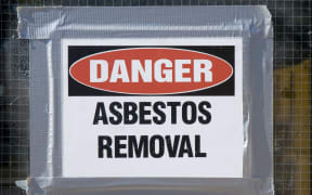 A file photo of a sign warning about asbestos removal