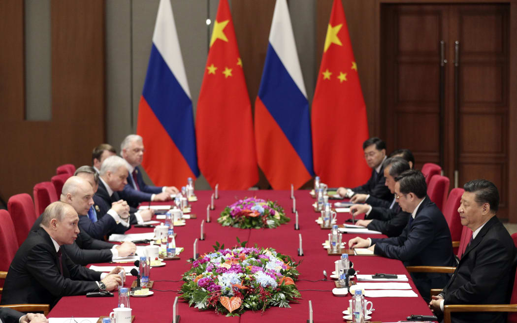 Russian President Vladimir Putin, left, and Chinese President Xi Jinping, right, attend the meeting at Friendship Palace in Beijing Friday, April 26, 2019.