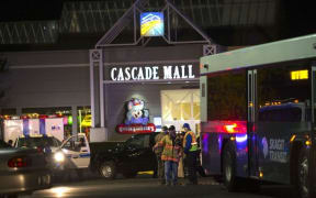 Police attend the Cascade Mall after three women were reportedly shot dead and a man critically injured following a shooting at the shopping center
