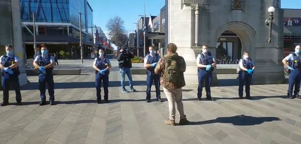 The police line up at an anti-lockdown protest in Christchurch.