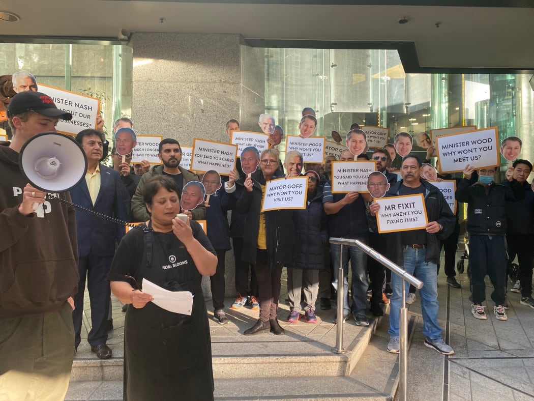 Two dozen people protested on the steps of the Auckland Council offices this morning demanding compensation.