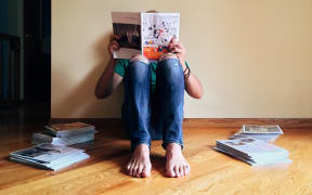 Person reading a magazine