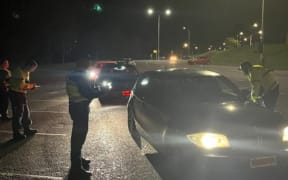 Police check cars as part of Operation Kereru, June 2024.