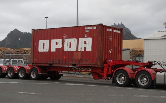 Alt text:
The fourth truck to leave Northport on Friday morning, carrying a container to Auckland. The cargo is from the ship Constantinos P which was diverted to Northport because of delays in unloading in Auckland.