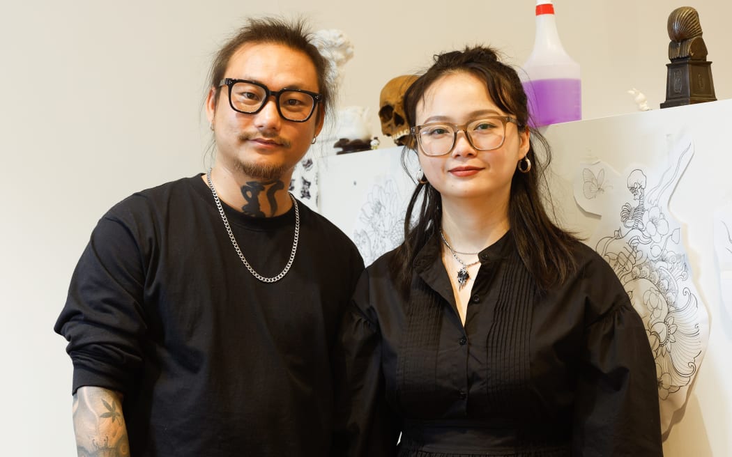 Tattoo aritists Aorigler and Xixi Zhang.