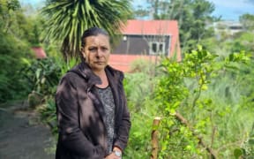 Phillipa Miller-Ibos at her flood-damaged home in Auckland.