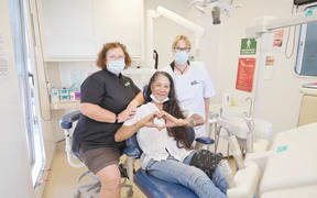 Sophie O'Neill received treatment on Tuesday from dentist June Fraser and dental assistant Lerlene Wright.
