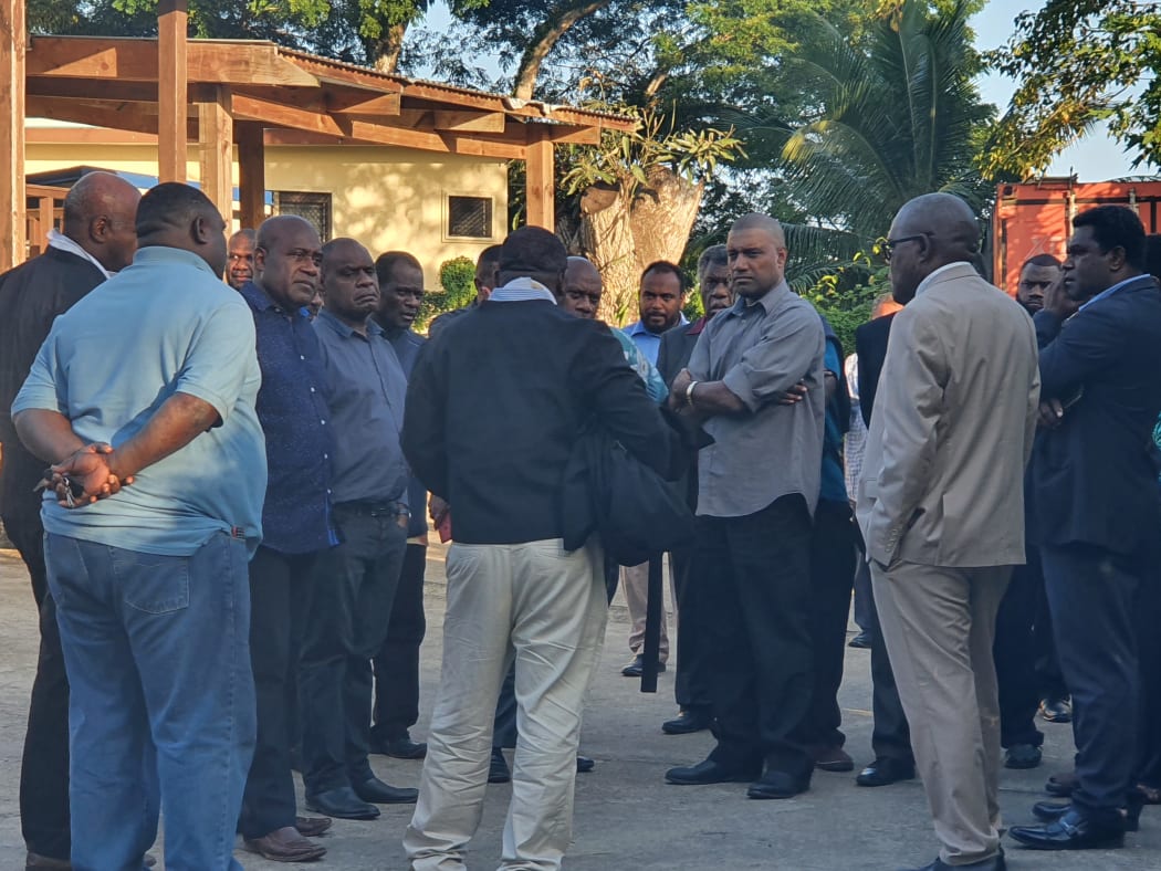 Vanuatu Government MPs milling outside court