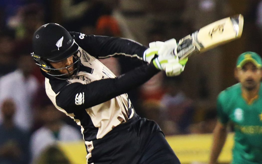 The Black Caps opener Martin Guptill hits a boundary against Pakistan.