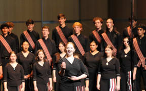 Choir member Sophia Gittings singing with the New Zealand Secondary Schools Choir, China, 2024