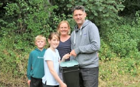 Fiona and family with the Bokashi bin provided to them for Wellington Council's Para Kai food waste trial