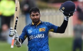 Sri Lanka batsman Kumar Sangakkara raises his bat after scoring a century at the Bellerive Oval.