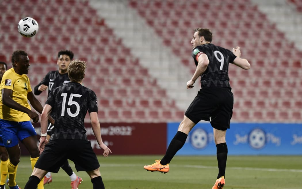 Chris Wood climbs to score for New Zealand against the Solomon Islands.