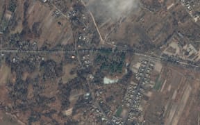 A Maxar satellite image taken and released on 27 February, 2022, shows a column of Russian military vehicles as they move towards Kyiv, on the P-02-02 road (Shevchenka Road) on the outskirts of Ivankiv.