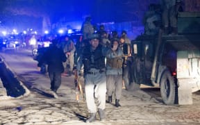 Afghan police at the scene of the explosion.