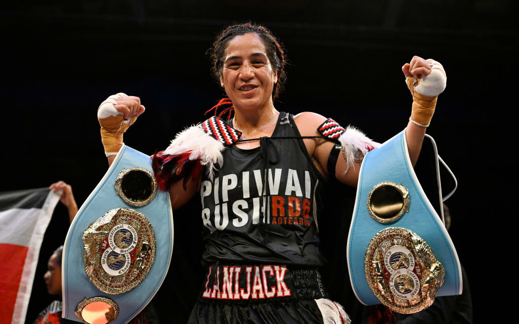Lani Daniels celebrates retaining the IBF Light Heavy World Title belt Wahine Toa II fight week.