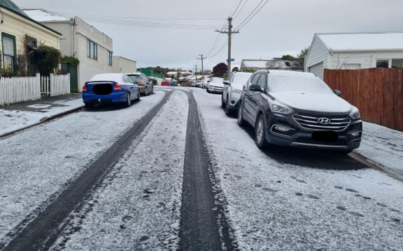 Snow-capped cars in Mornington, Dunedin on 6 September 2022.