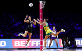 New Zealand's Ameliaranne Ekenasio and Courtney Bruce of Australia contest possession in their group match in Liverpool.