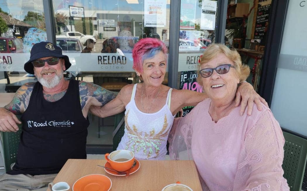 Dave Baxter (left), Brodie Baxter and Jill Baxter enjoy their free coffees at the Reload Cafe in Leamington.